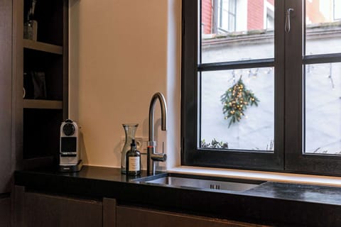 Cozy kitchen corner with modern espresso setup.
