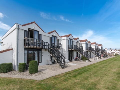 Sky, Cloud, Plant, Building, Land Lot, Urban Design, Grass, Landscape, Facade, City