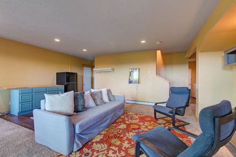 Lower level family room with kitchenette. Couch folds out to a queen bed