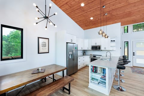 bright modern kitchen and dining area of entry level