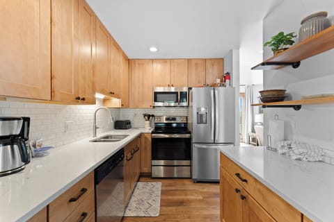 Updated kitchen featuring stainless steel appliances.