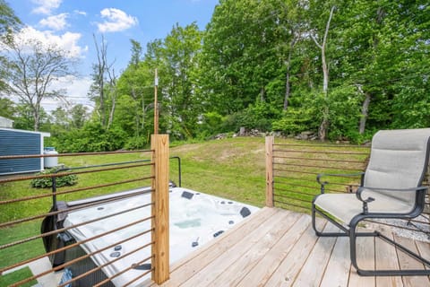The hot tub sits right below the deck, making it perfect for alternating between a soak and time lounging with your group above.