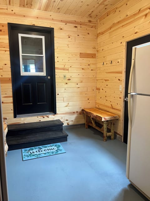 Garaage entry with benches and hooks for storage