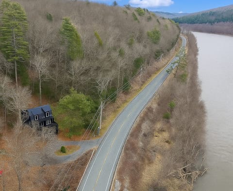 Directly across from the river with unobstructed nature and sunset views