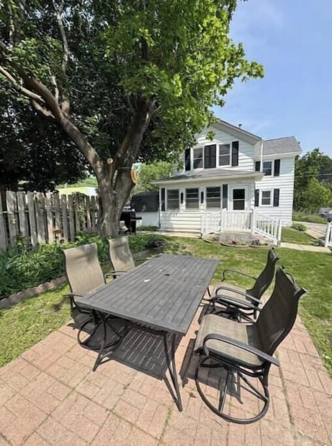 Patio table and chairs welcome you for a relaxing time after a day trip!a