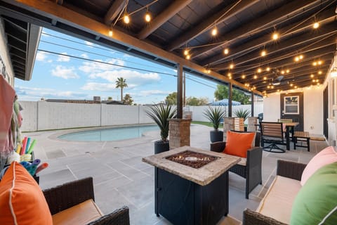 Resort-style backyard with lots of shade, grill, and turf area