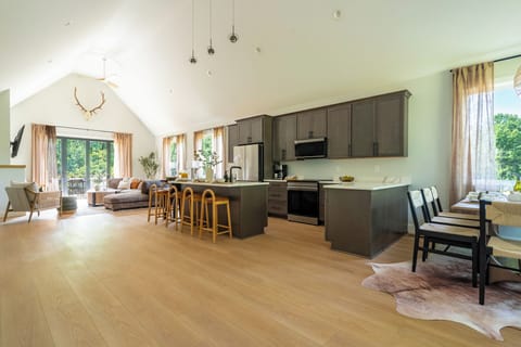 The open layout and vaulted ceilings make the space feel larger than life.