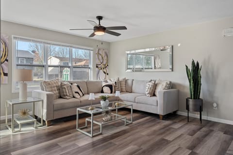 Main Level-Modern & bright! Relax in this chic living space a stylish sectional,