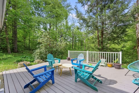 Relax and unwind on the deck surrounded by serene woodland views
