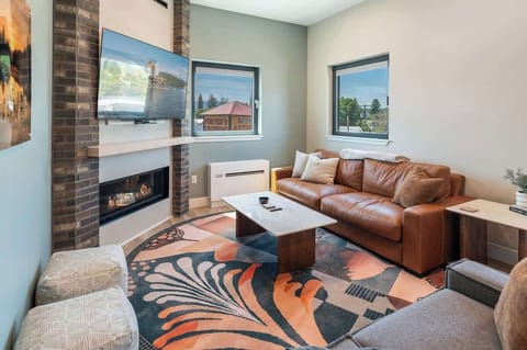Gas fireplace and plenty of natural light in this living space