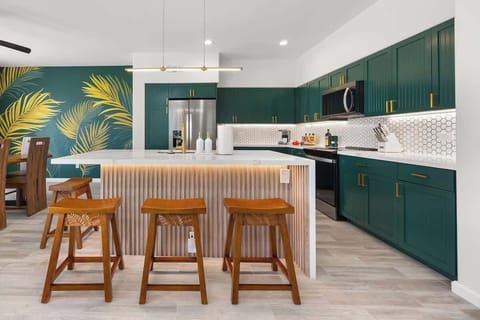 Modern chef’s kitchen with premium new appliances and tropical touches 
