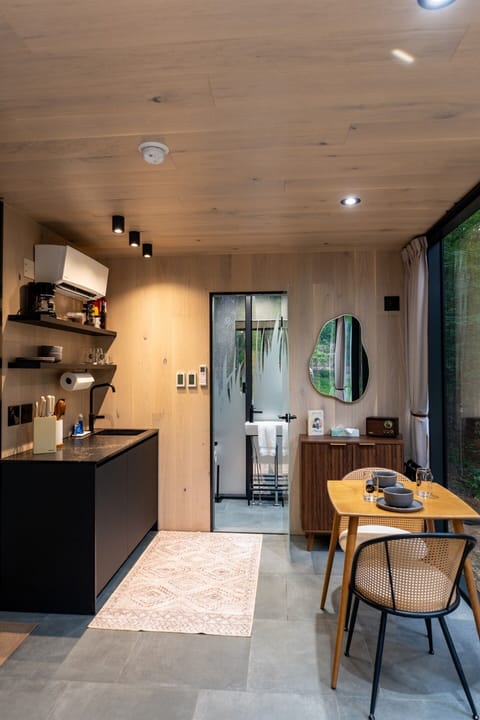 Thoughtfully designed for comfort and connection—enjoy intimate dinners, morning coffee, and wooded views all in one cozy, light-filled space.