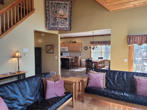LIVING ROOM:  Gorgeous living room with 2 futons, an electric fireplace, and a lovely view of Long Lake!