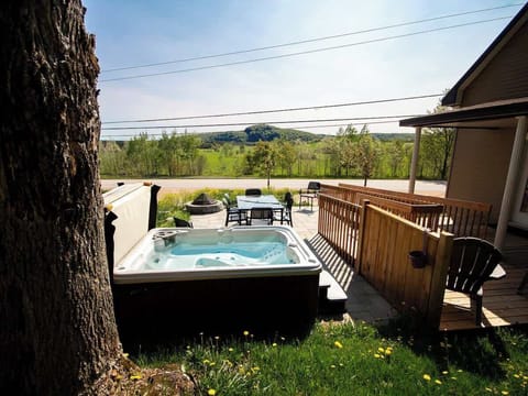 Relax in the private hot tub surrounded by the tranquility of nature.