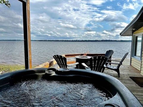 Soak in the hot tub while enjoying a peaceful riverside escape
