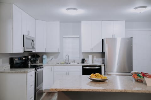 A bright and inviting kitchen setup offers a seamless blend of style and functionality for your culinary adventures.