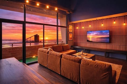 Living Room with Balcony View
Sink into plush comfort with a front-row seat to Sandusky’s skyline!