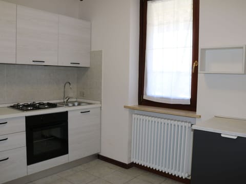 Kitchen, Flooring, Wood, Major Appliance, Kitchen Appliance, Countertop, Cabinetry, Interior Design, Floor, Kitchen Stove