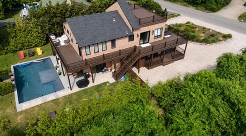 Drone shot ! Side of house with double deck balcony ! Backyard view with pool !