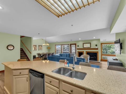 Kitchen: Main floor, drip coffee maker, toaster, cooking utensils, tableware

