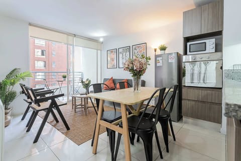 Bright and inviting living area with modern decor, perfect for relaxing or dining with friends and family.