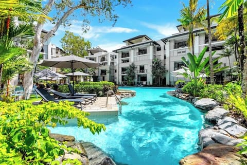 Dip into the expansive lagoon, where crystal water winds through lush gardens, creating a sense of peace and paradise.