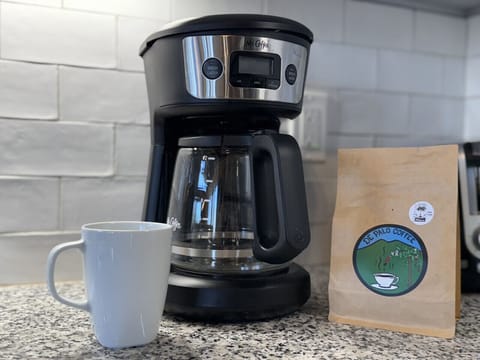 Brew your perfect cup with our coffee maker and complimentary coffee.