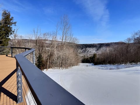 Cozy balcony with a breathtaking view of the snow-covered landscape.