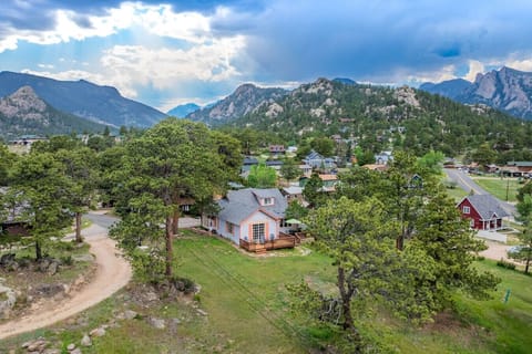 Grassy backyard with amazing mountain views from our cabin on top of the hill in the middle of downtown Estes Park