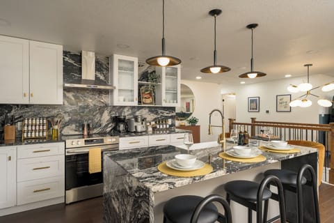 Cook, entertain, and gather in this modern chef’s kitchen featuring upscale finishes, full cookware, and thoughtful design.