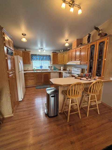 Large kitchen bar with two stools.
