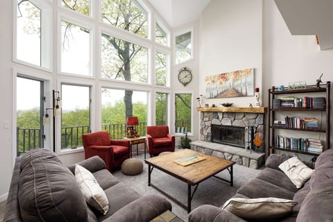 Step into comfort in this light-filled living room, where plush seating meets modern charm.