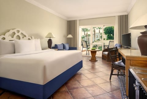 Wake up to garden views from a crisp, airy king bed.