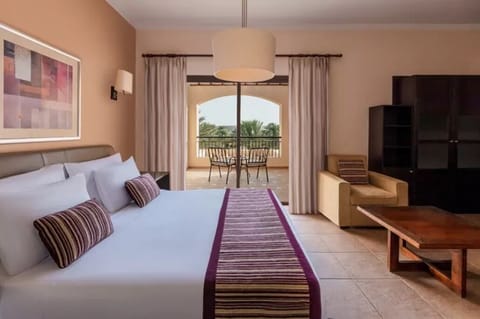 Unwind on crisp linens with breezy balcony views outside.