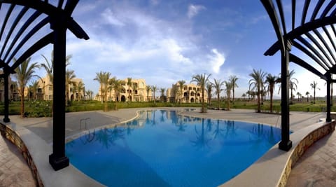 Dive into a serene lagoon-style pool under open skies.