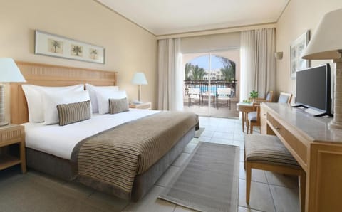Recharge in a bright king bedroom with balcony vistas.