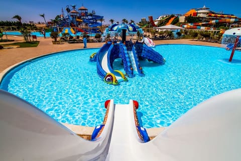 Picture yourself splashing into crystal pools with playful slides.