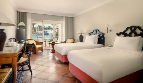 Spread out comfortably with two beds and sunny patio views.