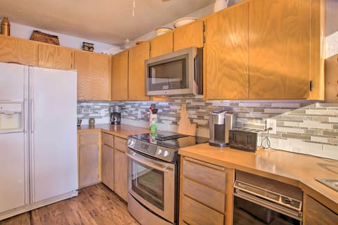 Functional and Inviting Space for Cooking. This kitchen balances style and practicality, making it perfect for preparing meals and enjoying culinary experiences. New stainless steel refrigerator Fall of 2025