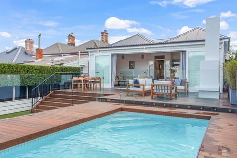 Enjoy the ultimate open plan living with indoor-outdoor flow. You can sit outside and keep an eye on the kids in the pool.