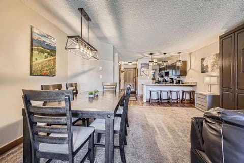 Cozy dining space with plenty of natural light and a stunning balcony view — perfect for meals with a breeze and a view!