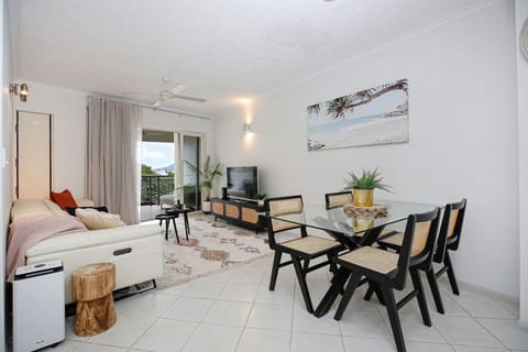 Comfortable dining area with seating for four, perfect for enjoying meals with family or friends. Bright and airy space with natural light, located just off the kitchen and living room — ideal for relaxed dining during your Cairns stay.