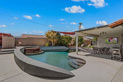 Heated pool with hot tub and entertainment