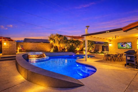 Heated pool with hot tub and entertainment