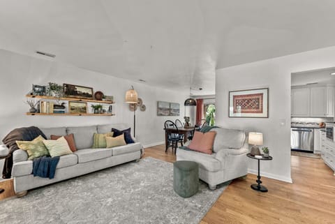 Spacious living room with comfy seating and large smart TV