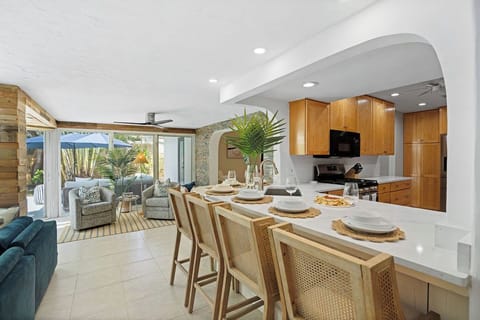 Gather 'round the heart of the home! 🥂 Our spacious kitchen island with bar seating is perfect for casual breakfasts or evening cocktails, flowing seamlessly into the living area. 🍳✨