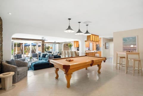 Entertainment central! 🎱 Our spacious open-concept area combines comfortable lounging with a fun pool table, perfect for making memories with your group! 🎉🥂