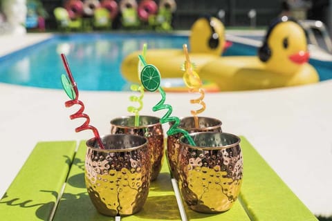 Enjoy your favorite refreshing beverage soaking up the sun poolside.