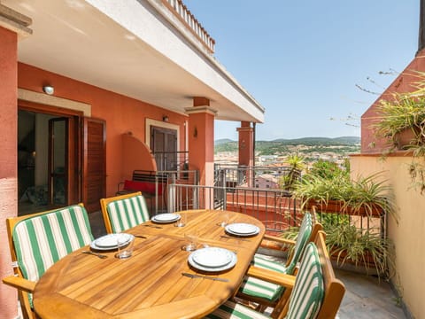 Furniture, Chair, Outdoor Furniture, Table, Outdoor Table, Kitchen & Dining Room Table, Umbrella, Shade, Restaurant, Patio