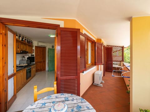 Furniture, Chair, Outdoor Furniture, Table, Outdoor Table, Kitchen & Dining Room Table, Umbrella, Shade, Restaurant, Patio